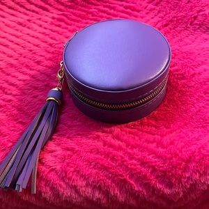 purple round compact jewelry bow with tassel